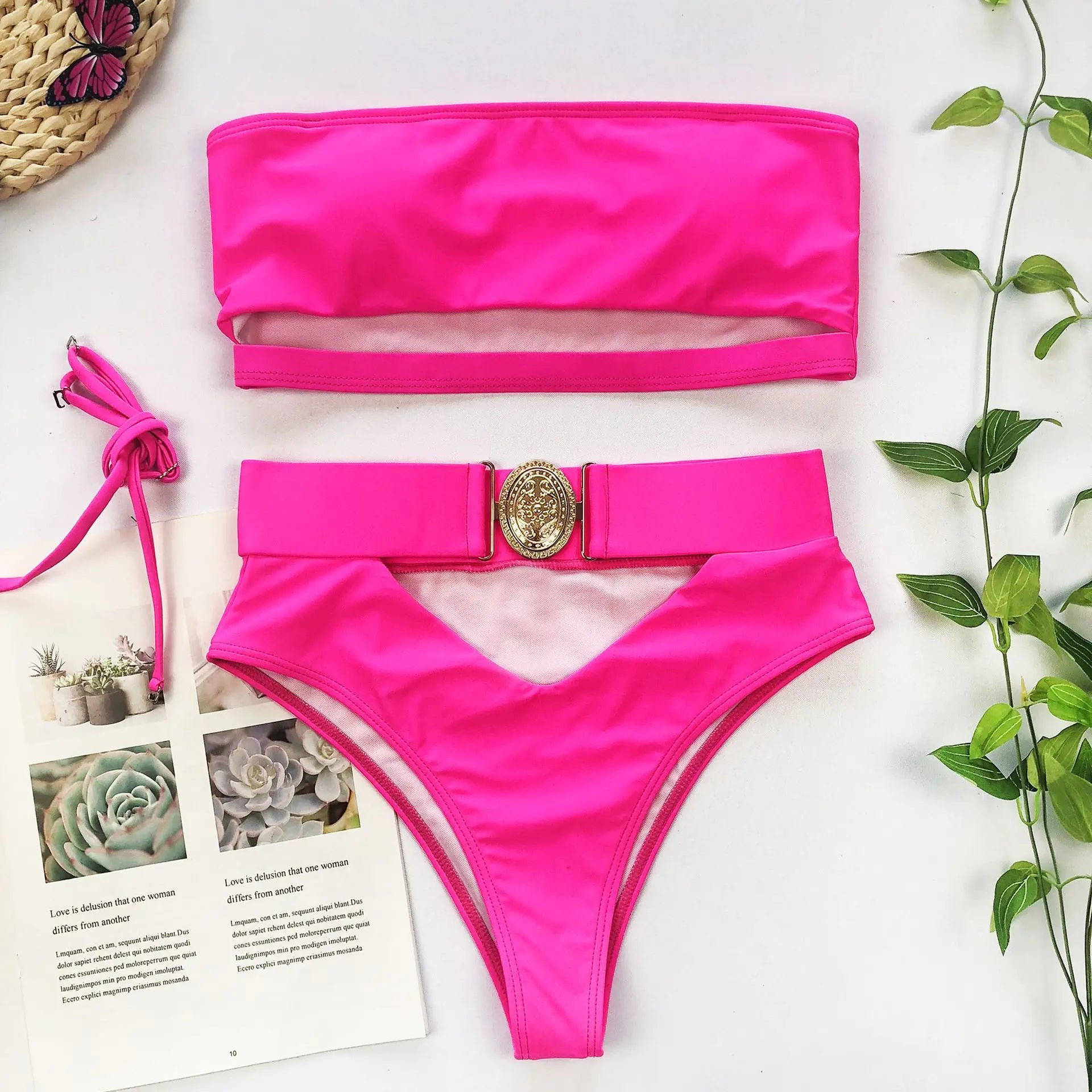 Rose red bandeau bikini with high-waisted bottoms and gold medallion buckle