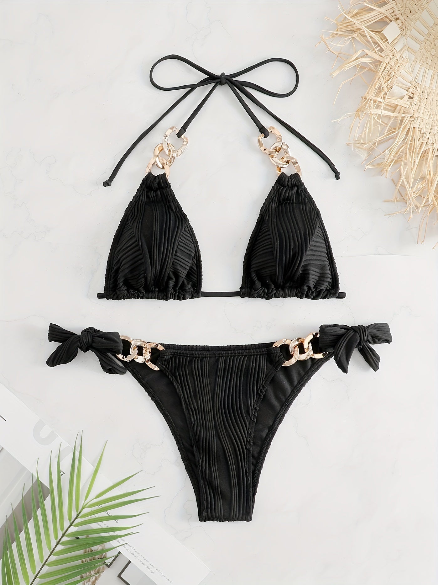 Black striped halter bikini set with gold ring-link detail and bow tie side ties