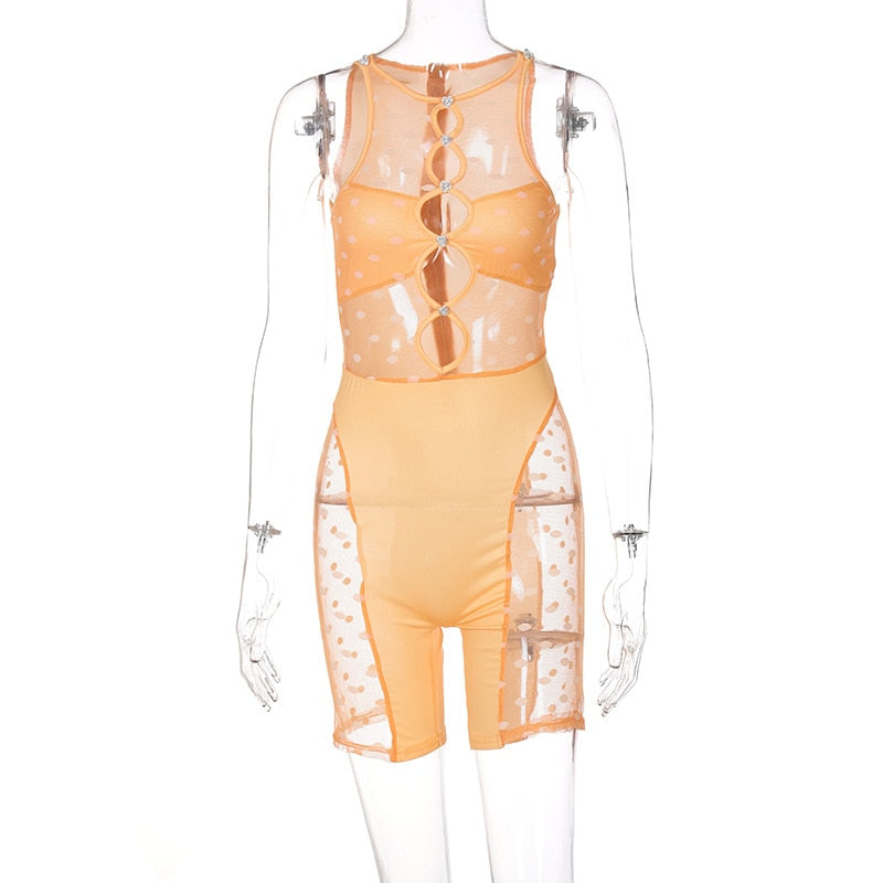 Orange sheer sleeveless bodysuit with ring cutouts at chest and attached shorts