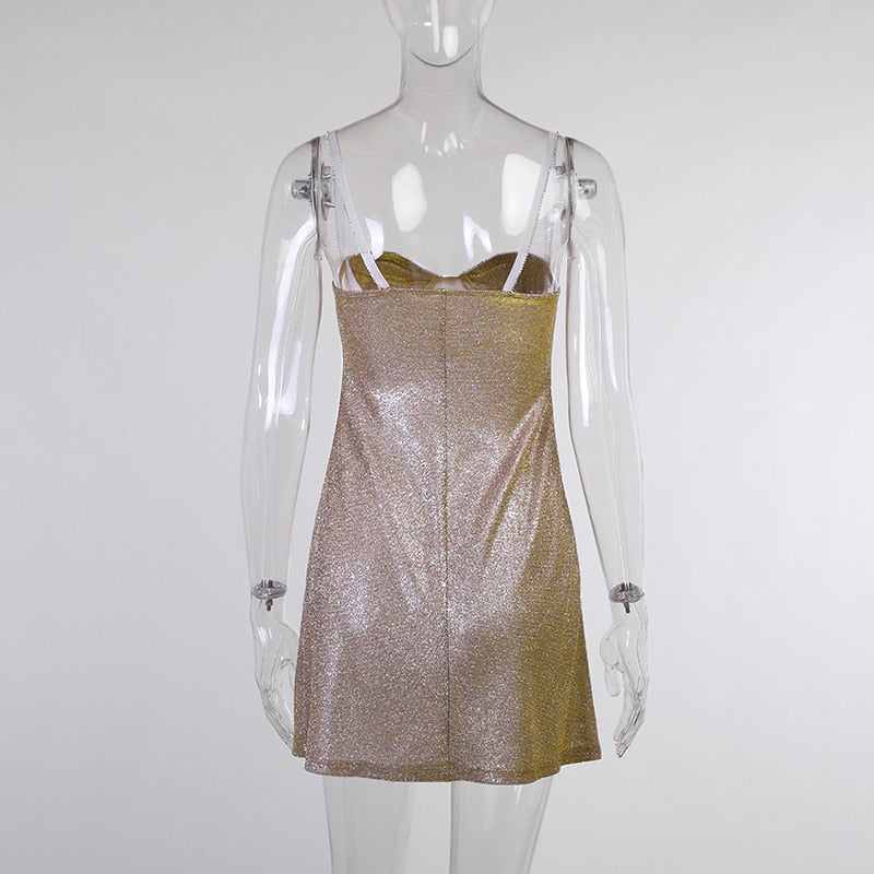 Gold-tone sequin mini dress on mannequin with spaghetti straps and straight hem