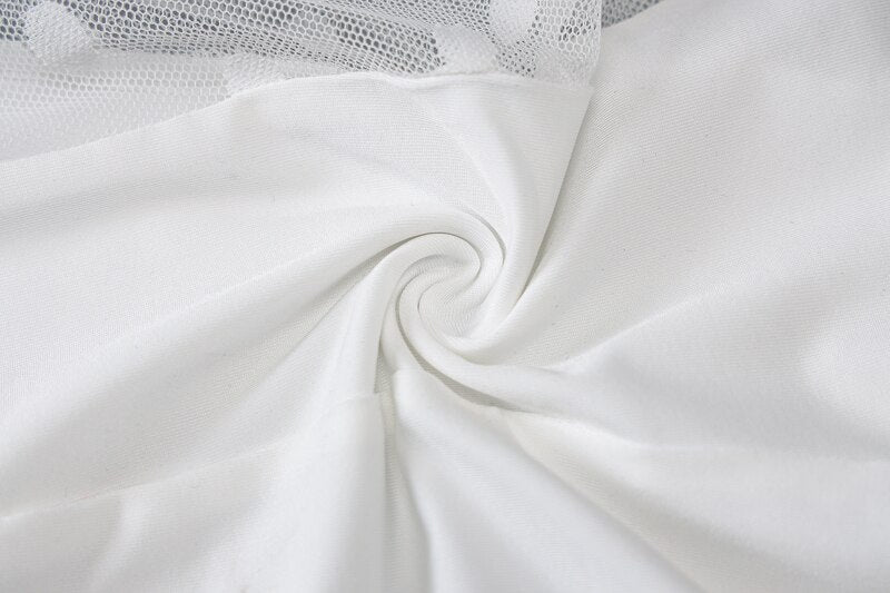 White sheer bodysuit fabric close-up with smooth drape and mesh texture