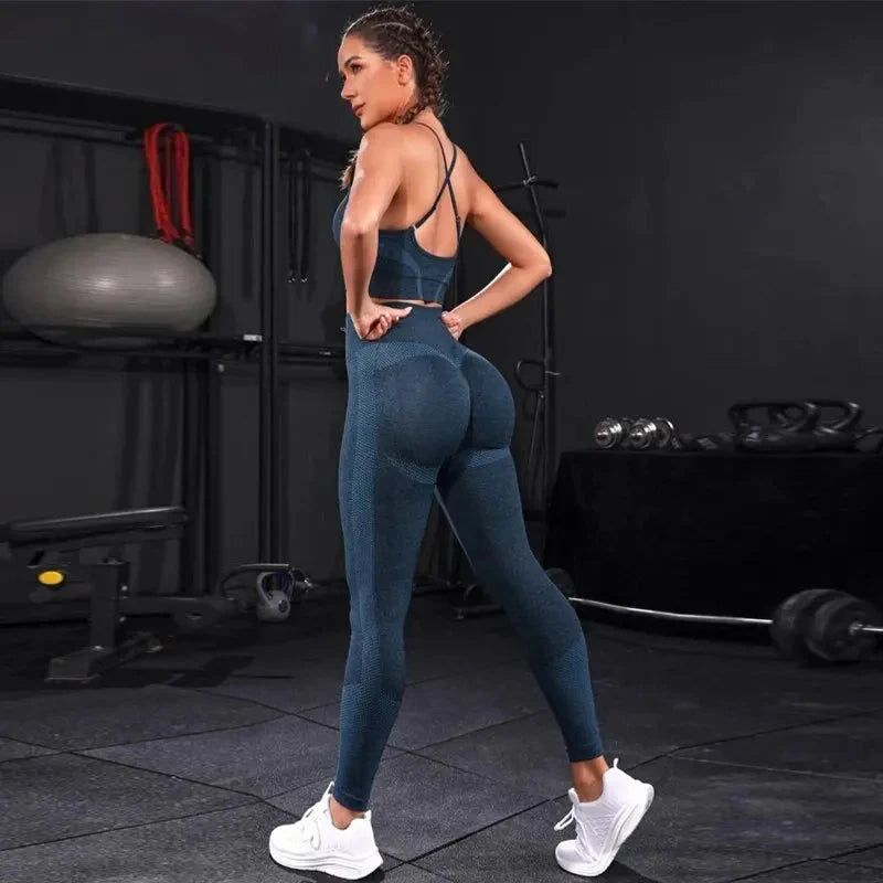 Blue strappy sports bra and high-rise leggings set, full-length side view