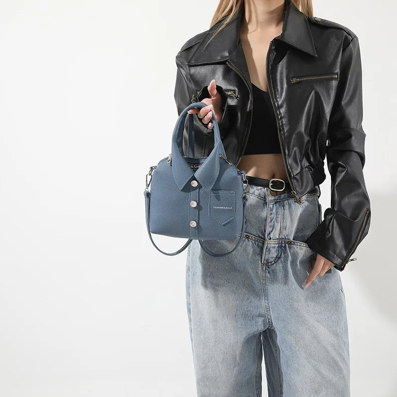 Blue textured mini bag with button-front collar, front pocket, and crossbody strap