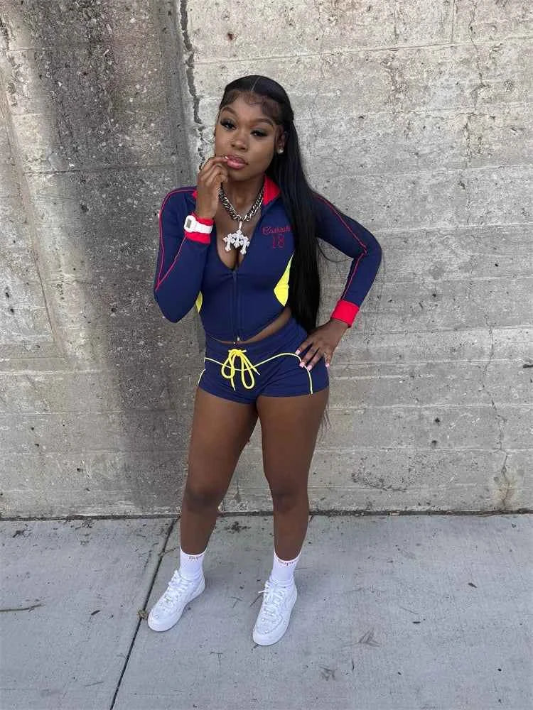 Color-block zip jacket and drawstring shorts set, navy blue with red cuffs and yellow