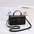 Black quilted handbag with top handle, gold chain trim, and crossbody strap