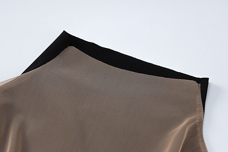 Sheer mesh fabric panel with black trim edge