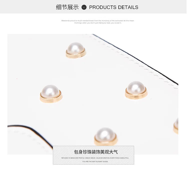 Close-up of pearl studs on a white flap handbag with smooth leather trim.