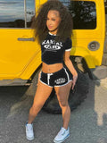 Black cropped T-shirt and matching shorts set with white trim and KARTAL AK logo.