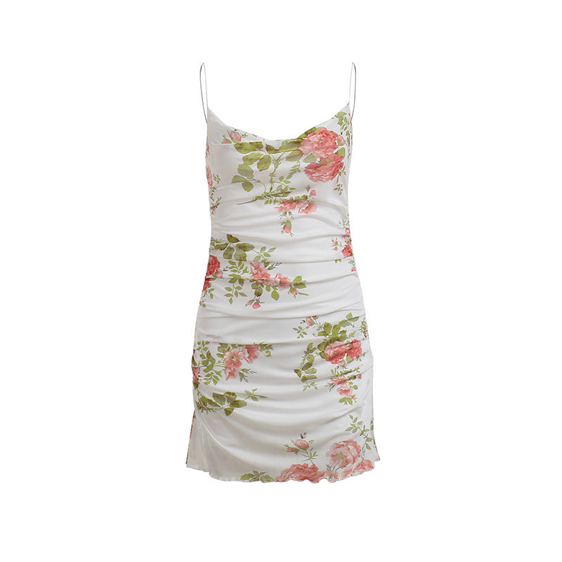 White floral slip dress with pink roses, green leaves, spaghetti straps and ruching