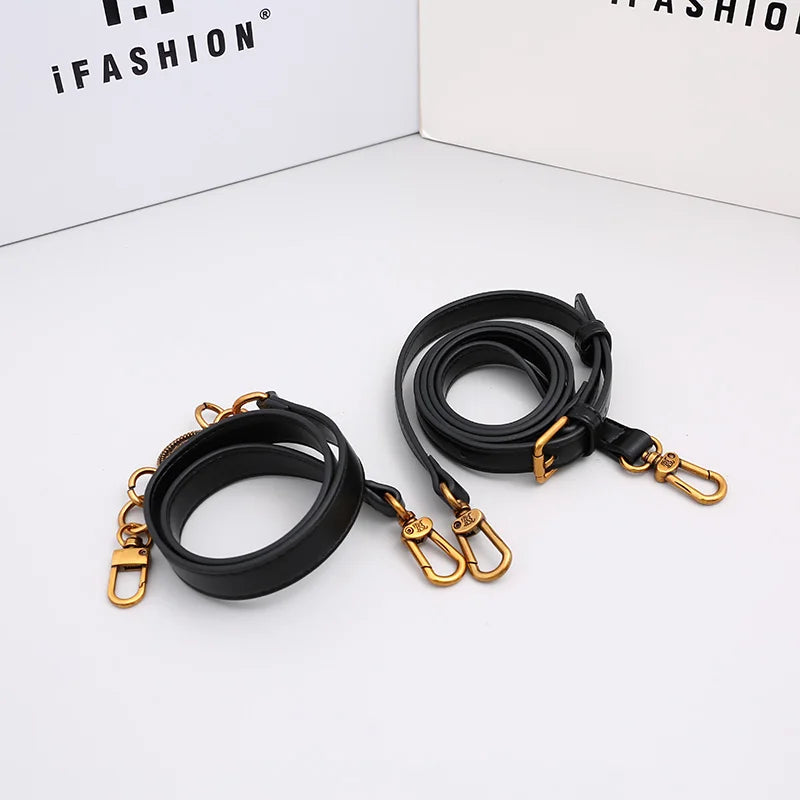 Black handbag strap set with gold clasps and adjustable shoulder strap
