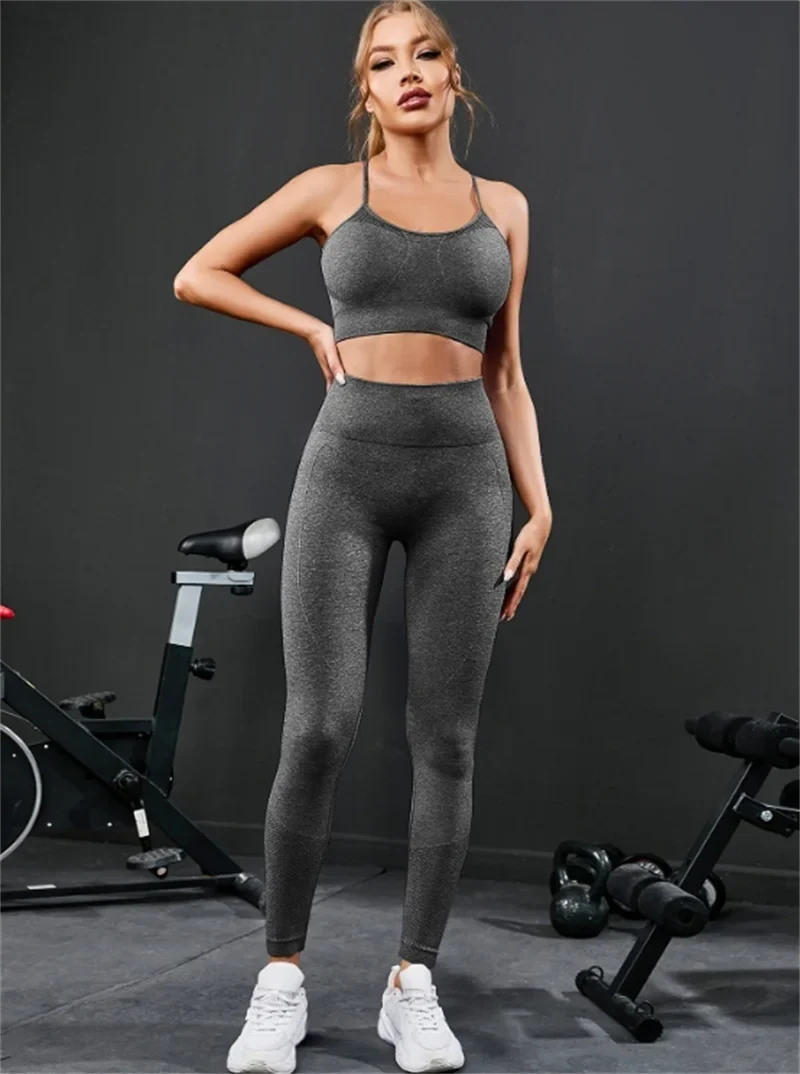 Grey strappy sports bra and high-rise leggings set, full-length standing