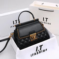 Black quilted mini handbag with top handle, flap front and gold chain detail