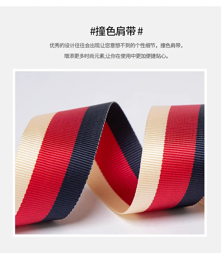 Red, navy, and beige striped webbing bag strap with gold chain hardware