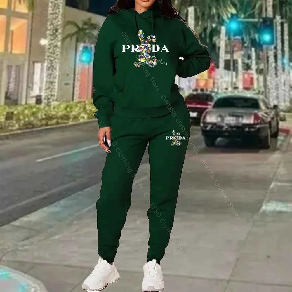 Women's 2-piece hoodie and jogger set, dark green with PRADA logo on chest and pants.