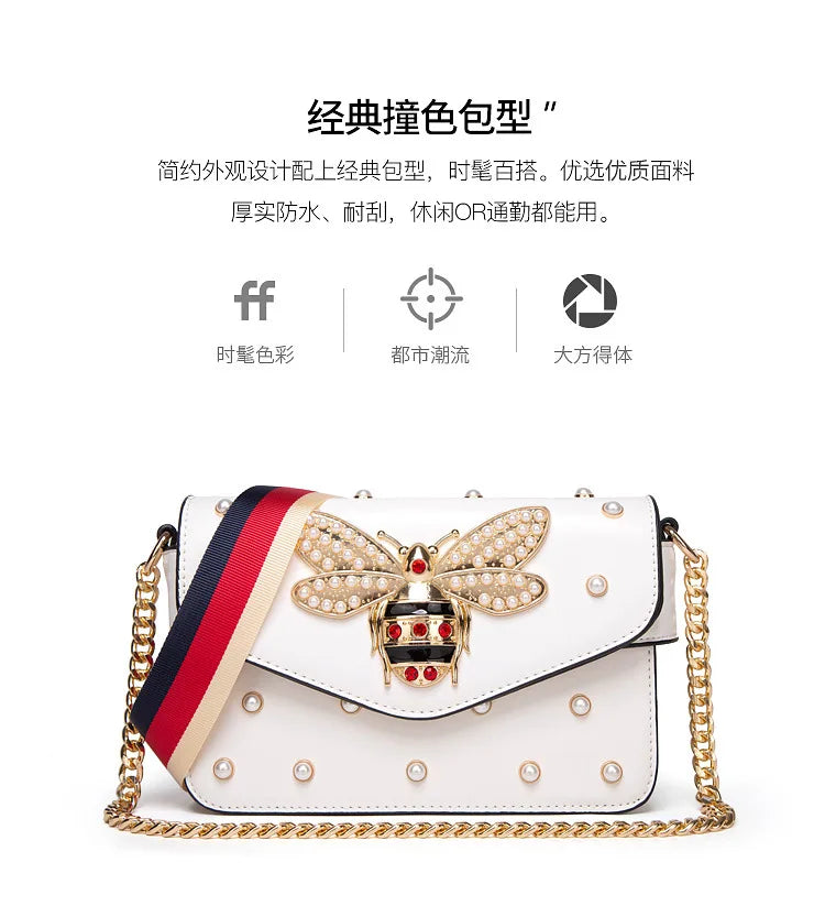 White jeweled bee bow flap shoulder bag with pearl studs and gold chain strap