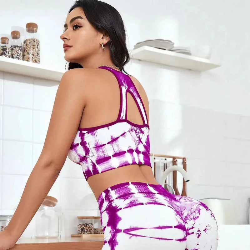 Tie-dye sports bra and biker shorts set, purple and white, strappy racerback, side view
