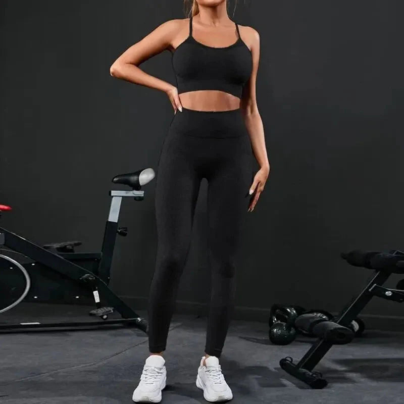 Black strappy sports bra and high-rise leggings set, full-length standing