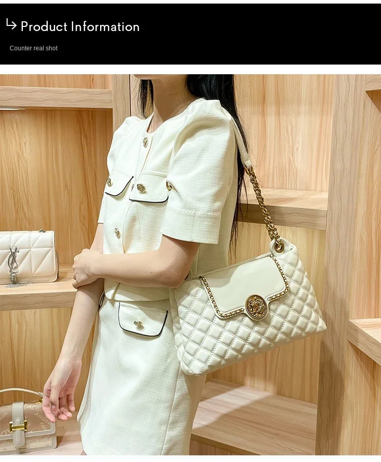 White quilted shoulder bag with gold chain strap and circular gold medallion front clasp