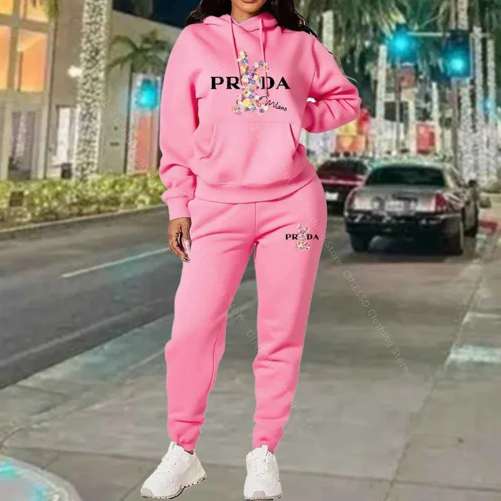 Women's 2-piece hoodie and jogger set, light pink with PRADA logo on chest and pants.