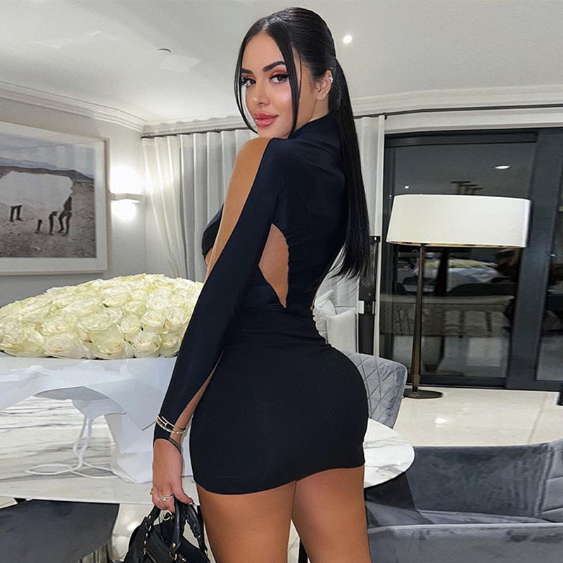 Black cutout bodycon mini dress with sheer long sleeves, side view