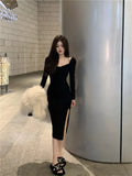 Black square-neck midi sheath dress with long sleeves and side slit