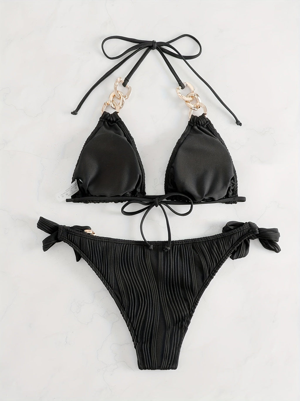 Black striped halter bikini set with gold ring-link detail and bow tie side ties