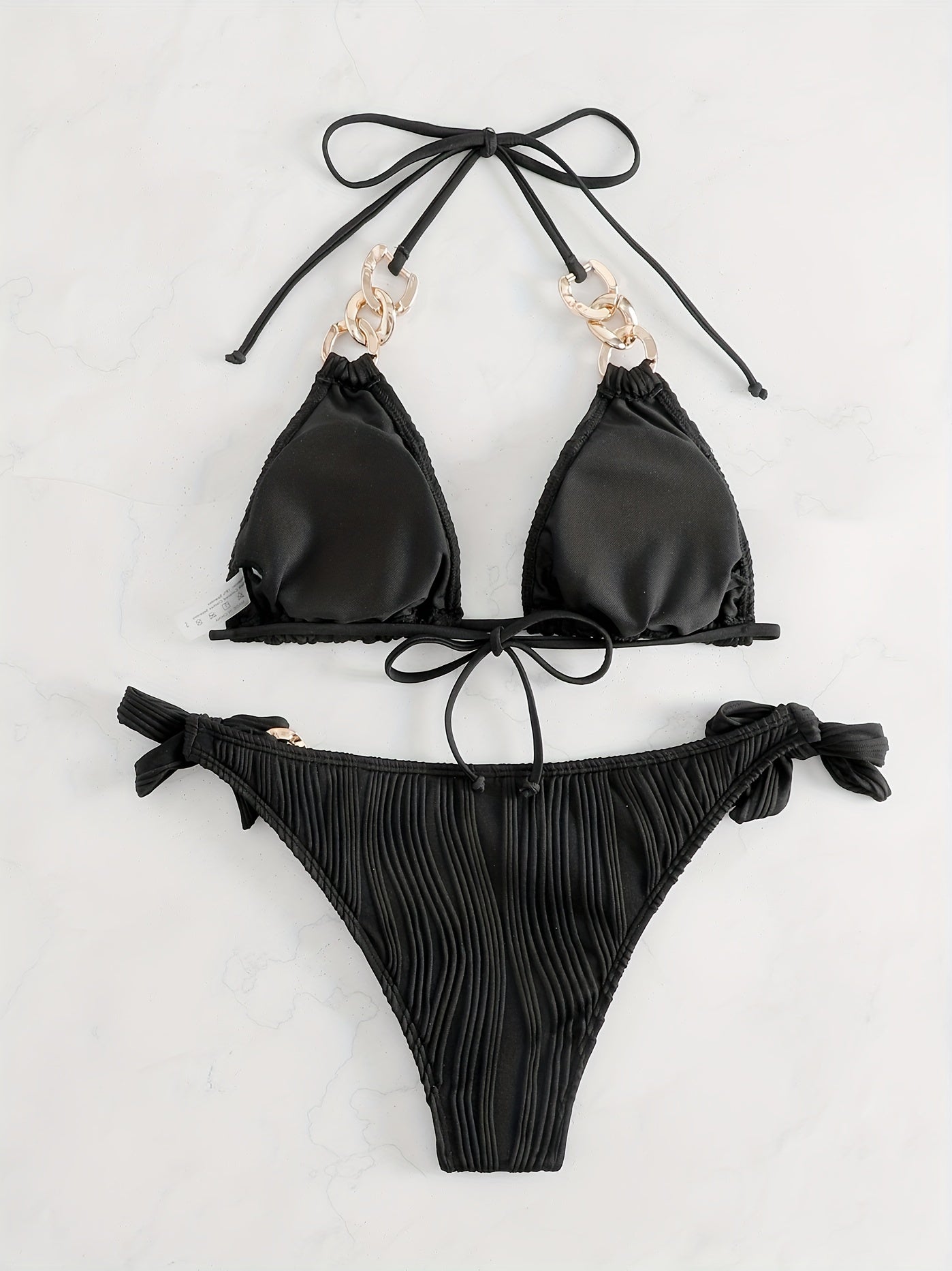 Black striped halter bikini set with gold ring-link detail and bow tie side ties