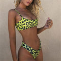 Leopard print bikini set with triangle top and high-leg bottoms, neon yellow-green and black.