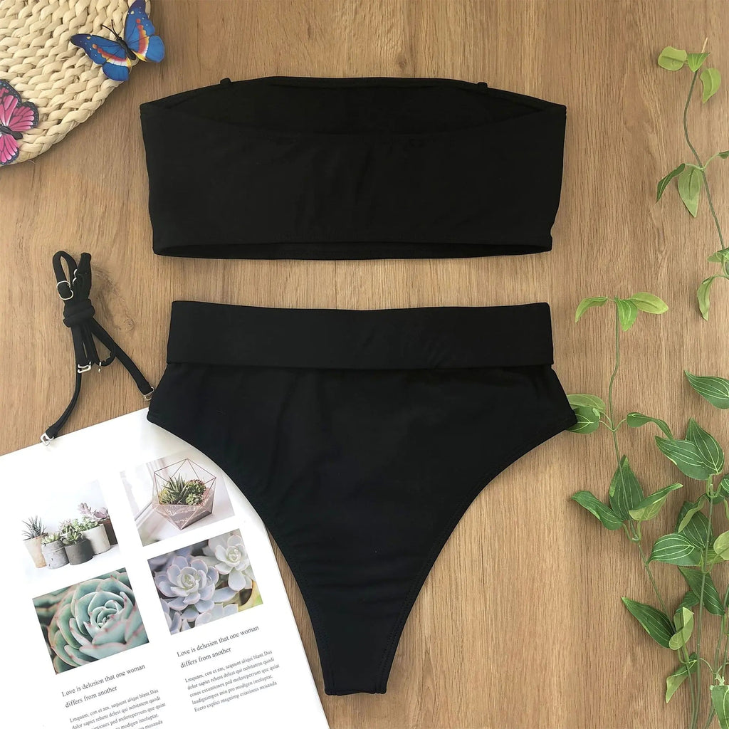 Black bikini set with bandeau top and high-waist bottoms plus gold center buckle