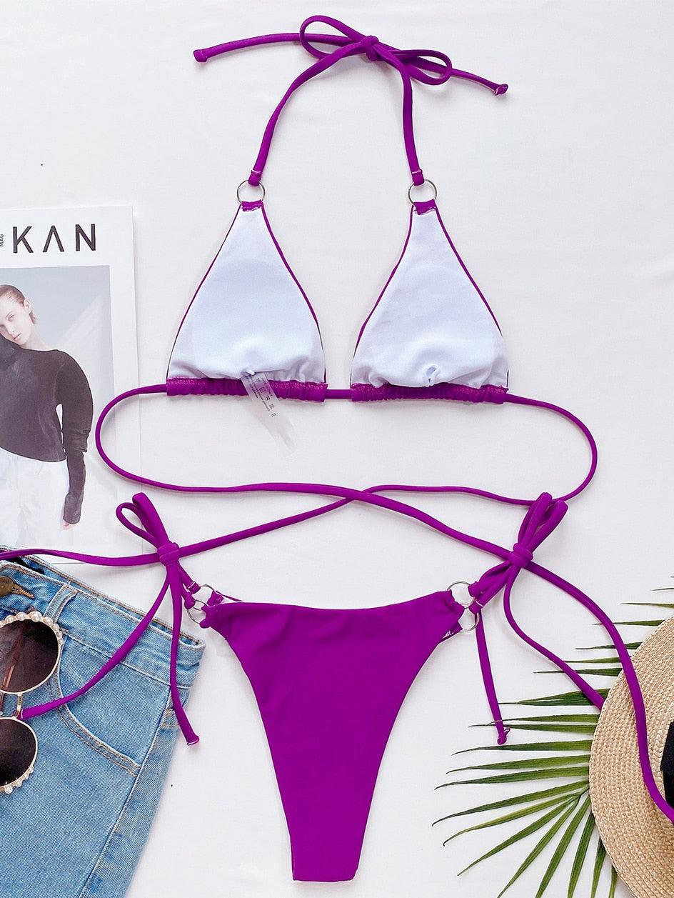 Purple and magenta triangle bikini set with halter ties and strappy side bottoms