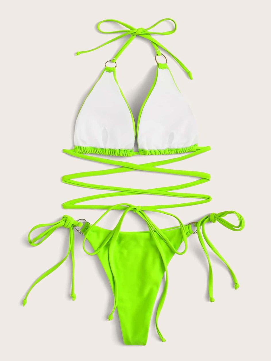 White triangle bikini set with neon green trim and tie-side bottoms