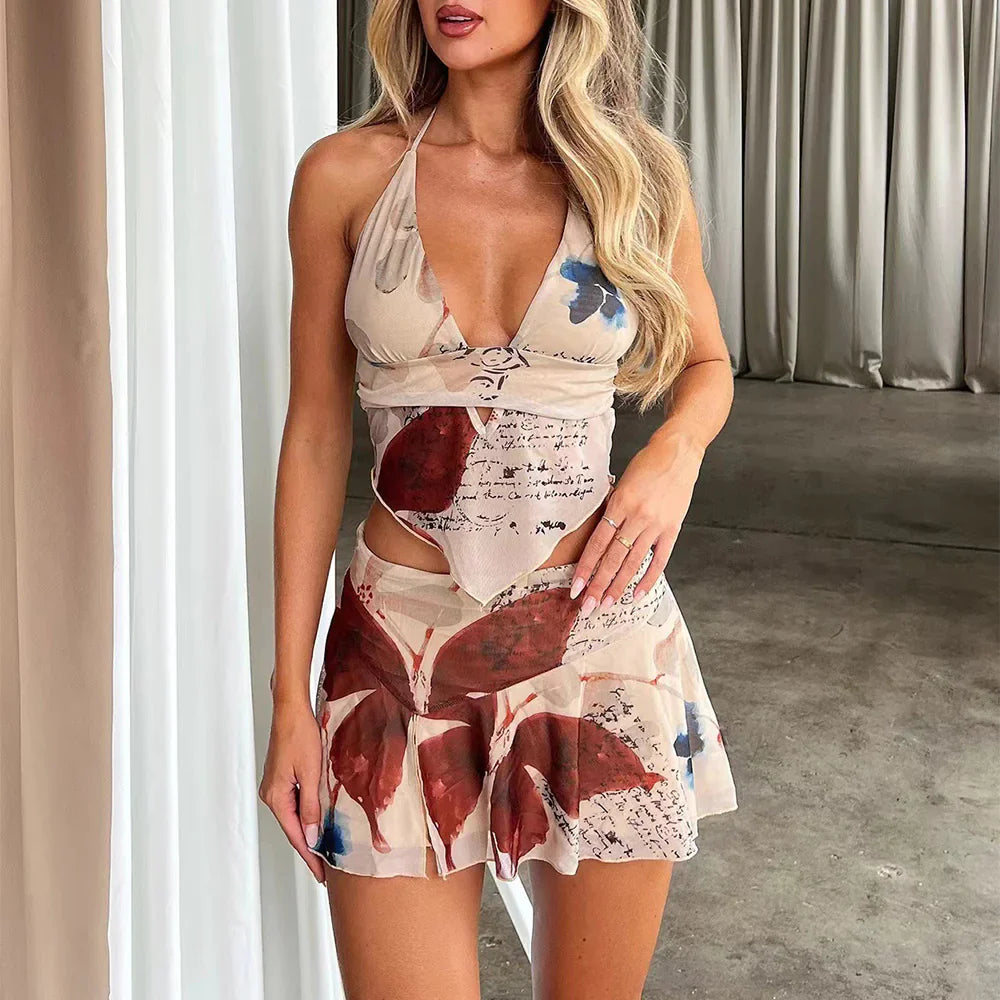 Printed halter two-piece set with V-neck crop top and high-waist mini skirt, cutout